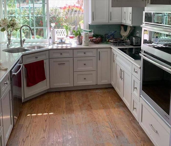 Kitchen with water damage on the floors