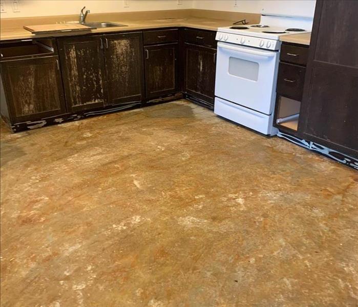 Kitchen with no flooring after water damage